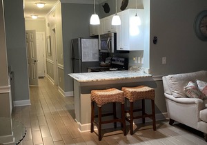 1st Floor Unit W/Patio, Golf Course and Pool View, less than 10 Min to the Beach
