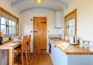 A perfectly formed shepherds hut that has been styled and furnished with flair.