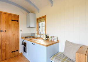 A perfectly formed shepherds hut that has been styled and furnished with flair.
