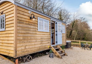 A perfectly formed shepherds hut that has been styled and furnished with flair.