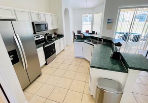 Ample space and modern elegance await at this 5/3 Pool Home located at Highlands Reserve Golf and Country Club