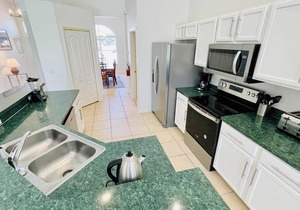 Ample space and modern elegance await at this 5/3 Pool Home located at Highlands Reserve Golf and Country Club