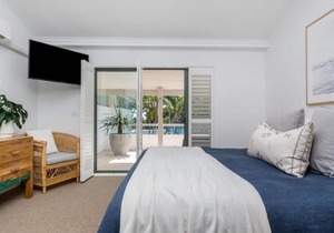 Beautifully designed 4 bedroom, 4 bathroom home right across the road from beach