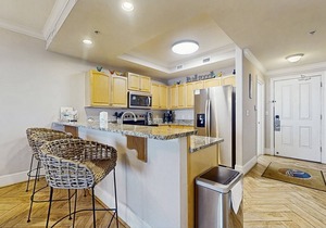 Bright & beachy waterfront condo with pools, tennis, gym, spacious balcony & W/D