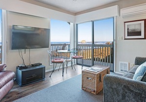 Dog-friendly, oceanfront condo w/ beach access, cozy fireplace, and large deck