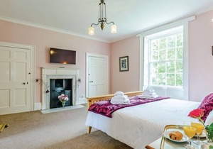 Ground floor: Three living areas, two with open fire, TV with Freeview/DVD.