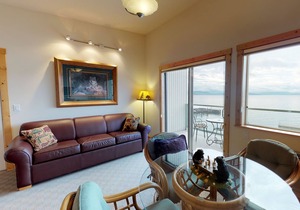 Lakefront condo with water-view balcony, central AC & swimming dock