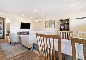 Located directly on the white sands of Pine Point Beach.