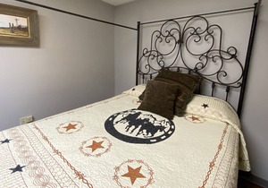 Rent a private room in a hostel type building with 1 queen bed for 2 adults.