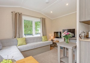 Shepherd’s Hut with an open plan design with king-size bed.