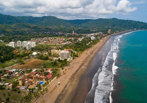 Stunning beachfront condo with WiFi, shared pool, & sweeping ocean views