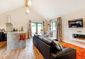 Stylish and luxurious open plan lodge with underfloor heating and smart TV.