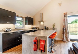 Stylish and luxurious open plan lodge with underfloor heating and smart TV.