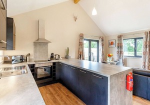 Stylish and luxurious open plan lodge with underfloor heating and smart TV.