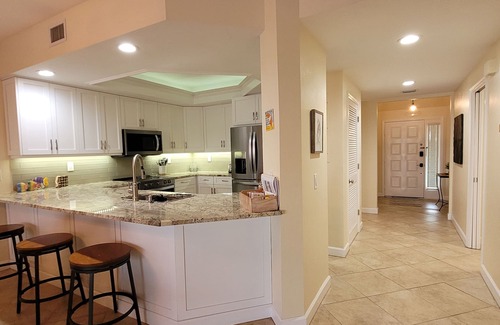 Vanderbilt Beach Condo | 1st Floor Condo Direct Bay/Gulf Beach Views! Steps To Beach!
