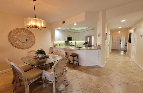 Vanderbilt Beach Condo | 1st Floor Condo Direct Bay/Gulf Beach Views! Steps To Beach!