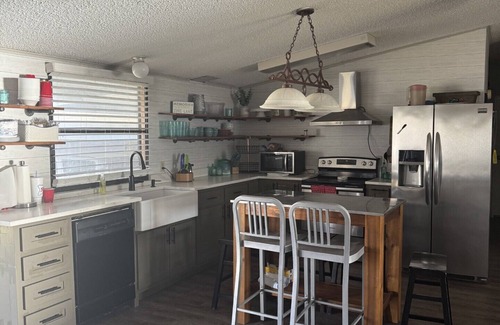 Graford House | 3B/3B Lake front property with dock, hot tub, and entertainment area outside!
