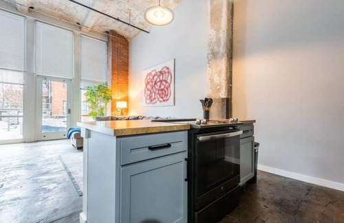 Crossroads Arts District Apartment | 3BR Luxury Historic Loft with Gym