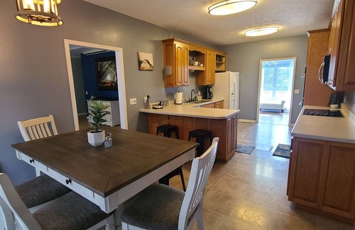 Pomona House | A large country home with scenic views of a working cattle farm & rural locale.