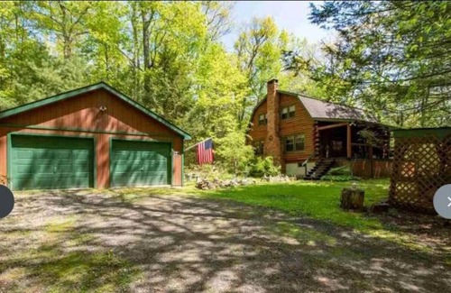 Kerhonkson House | A modern "State of the Art" Log Cabin nestled in a serene wooded property.