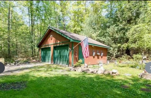Kerhonkson House | A modern "State of the Art" Log Cabin nestled in a serene wooded property.