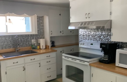 Ludington House | Adorable, “ Beach View Cottage” Lake Michigan views! Best location!