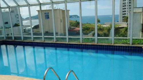 Morro do Maluf Apartment | Apê da Mi - 2 min da Praia de Pitangueiras - Guarujá