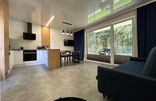 Ustka Apartment | Apartamenty w sam las by KLIF Ustka - apartament na parterze z tarasem i parkingiem