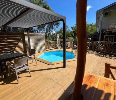 Rifflet Apartment | Appartement avec vue jardin à Deshaies 80 m² avec piscine