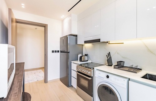 Jumeirah Village Circle Apartment | Apt with Artful Interior and Urban Views