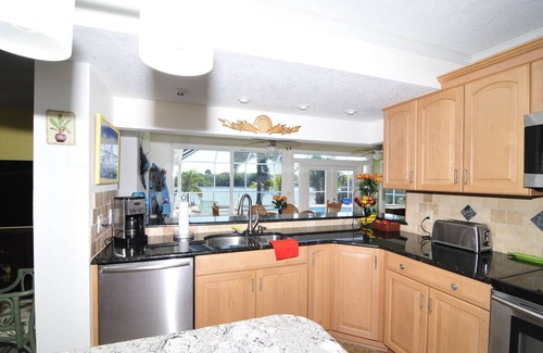 Port Canaveral House | Banana River Beauty-Five bedroom waterfront home with heated pool and spa
