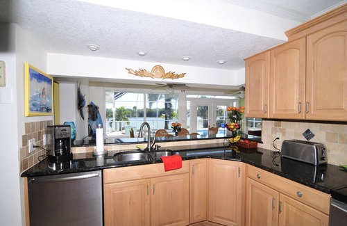 Port Canaveral House | Banana River Beauty-Five bedroom waterfront home with heated pool and spa