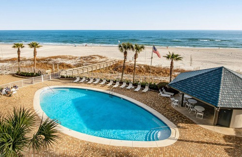 Orange Beach Condo | Beachfront corner condo with pools, a hot tub, tennis, & sauna