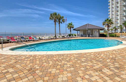 Orange Beach Condo | Beachfront corner condo with pools, a hot tub, tennis, & sauna