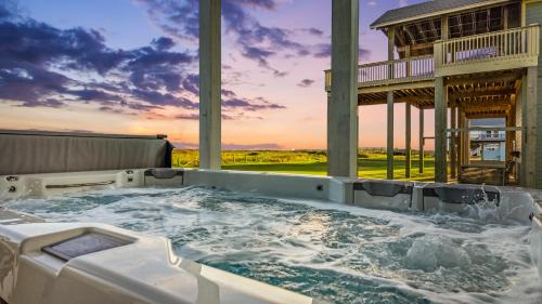 Galveston House | Beachfront Hideaway! Luxury Beachfront, SwimSpa, Game Room, Firepit by Bolivar Vacations