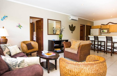 Playa Flamingo Condo | Beautiful Condo in Peaceful Cliffside Location with a Private Balcony & Stunning Ocean and Mountain Views