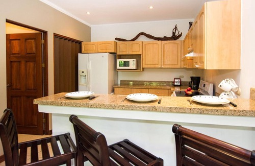 Playa Flamingo Condo | Beautiful Condo in Peaceful Cliffside Location with a Private Balcony & Stunning Ocean and Mountain Views