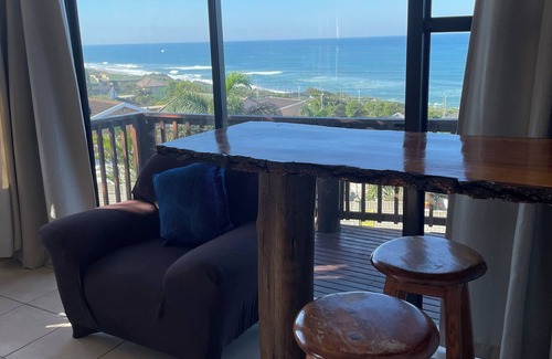 Warner Beach Cottage | Beautiful sea view from wooden balcony with sunrises to die for !