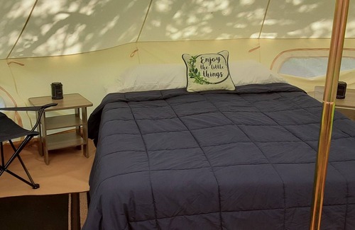 Spring Branch RV Rental | Bent Oak Glamping Tent Queen Bed, 2 Cots, Electric and AC