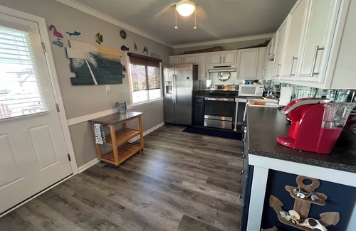 Surf City Cottage | Deep-Water Canal Front Coastal Cottage Only Steps to the Beach & Pet Friendly!