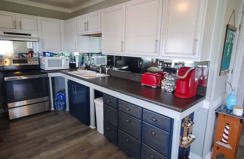 Surf City Cottage | Deep-Water Canal Front Coastal Cottage Only Steps to the Beach & Pet Friendly!