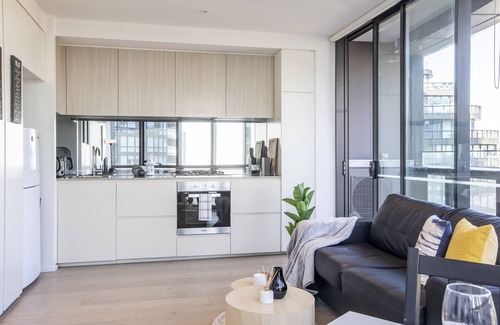Docklands Apartment | Docklands high level 1 Bedroom Apartment with pool by KozyGuru