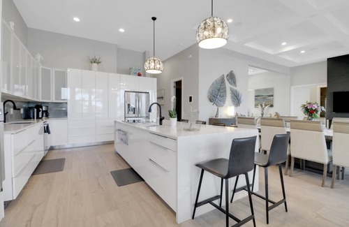 Pelican House | Dream Home Vacation! Stunning Waterfront! Luxurious Resort-Style Lagoon Pool, Spa & Outdoor Living!
