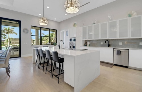 Pelican House | Dream Home Vacation! Stunning Waterfront! Luxurious Resort-Style Lagoon Pool, Spa & Outdoor Living!