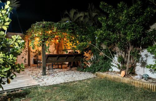 Bucana House | Expansive Paradise with Private Jacuzzi and Tropical Patio