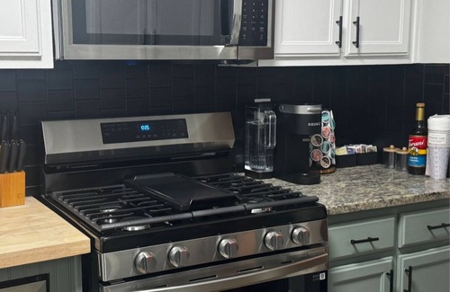 Church Street House | Fully Furnished Modern Home Patio with BBQ Grill for Relaxed Outdoor Living