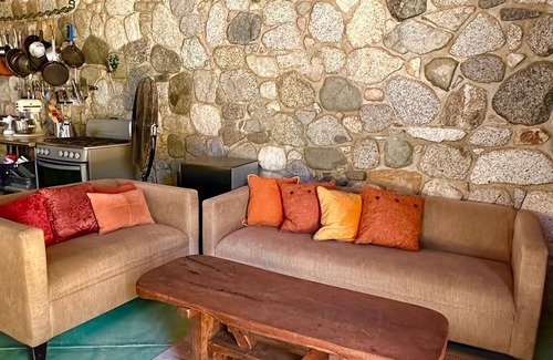 San Bartolo Villa | Glamping orchard and suites with large stone kitchen and pool in Baja Sur.
