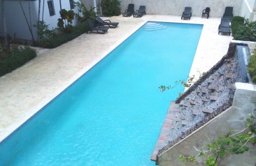 El Batey Apartment | Guest-friendly room in central Sosua, pool/Wifi/cable TV, near everything