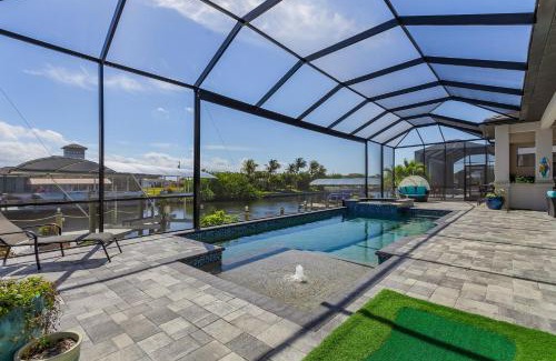 Burnt Store House | Gulf Access, Putting Green, Outdoor Kitchen, Heated Pool & Spa & MORE! - Villa Captain's Quarters