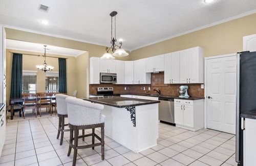 Bryan House | Host the Perfect Stay:15-Person House with Indoor Pool, 2 Grills & Entertainment